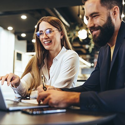 cheerful businesspeople using laptop office happy 2159023877