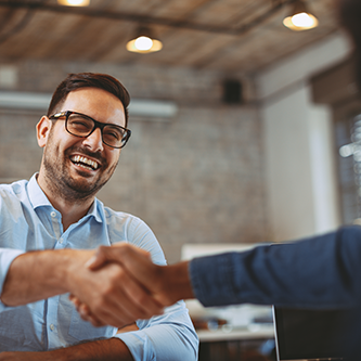 close up of handshake in the office 1049691002 500x250