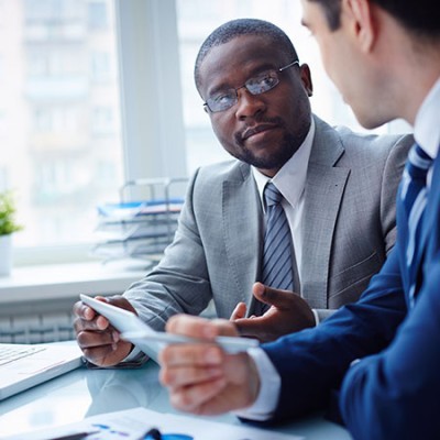 image of two young businessmen interacting at meeting in office 178724246