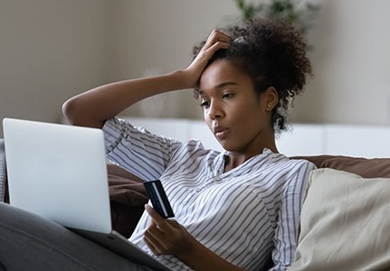 unhappy millennial african american woman distressed with problems paying online on laptop with 2025356384