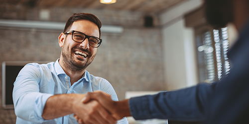 close up of handshake in the office 1049691002 500x250